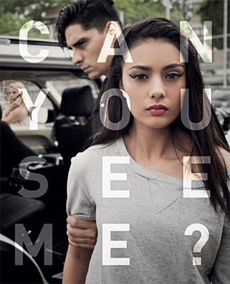 A teenage girl wearing a grey sweat-shirt is staring straight ahead. There is a male adult standing behind her. He is grabbing her arm in an effort to pull her into the backseat of the vehicle behind him. Through the driver-side window you can see an young woman on her cell-phone, staring at the man and the teenager. The words 'can you see me?' are over the image, but their transparency allows the image behind them to be visible.